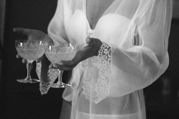 bride with cup of champagne in her hand 