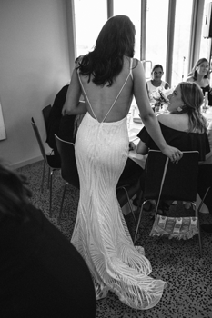 bride standing at her guest table