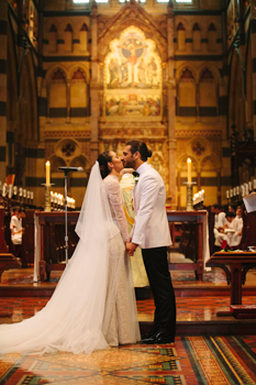 bride and groom at the church kissing