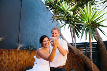 bride and groom with a phone on their hand