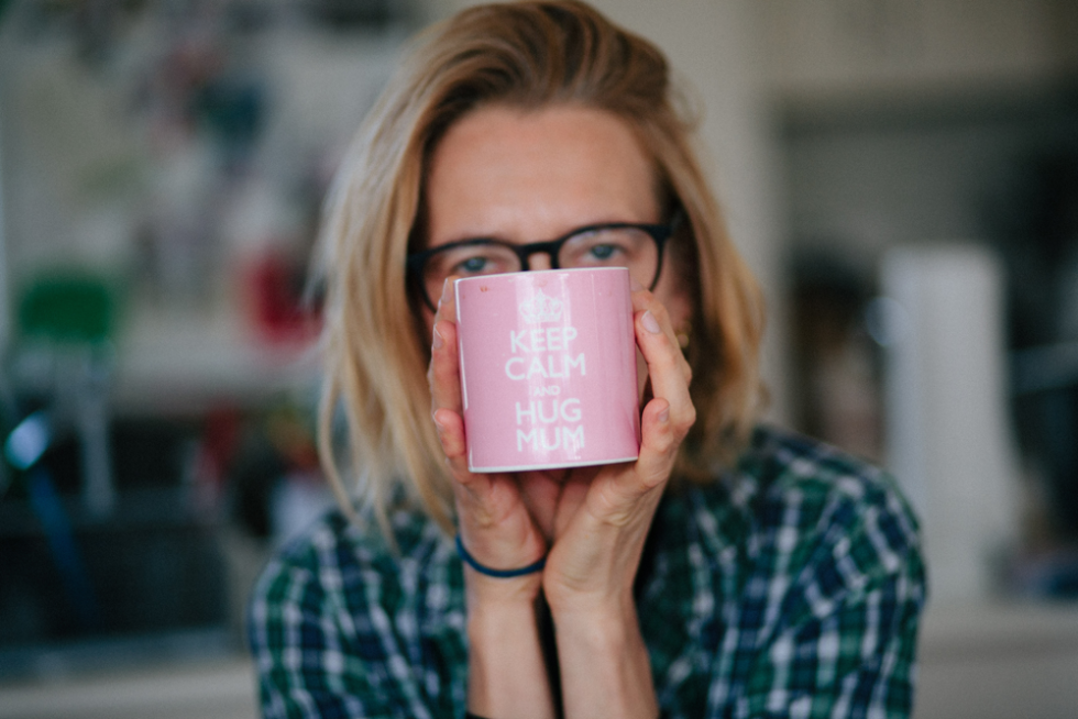 portrait of a woman with a cup front to her face