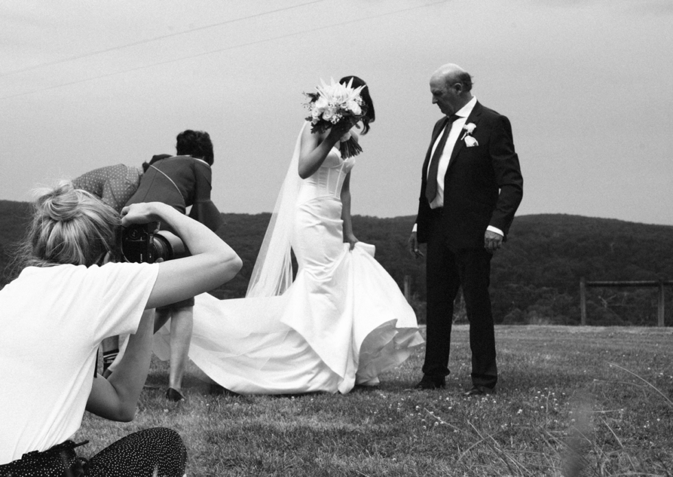 photographer taking photo at wedding