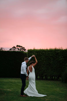 bride and groom at the sunset