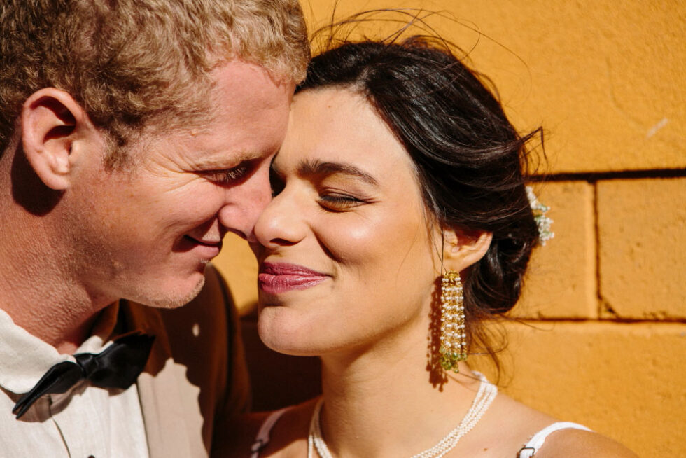 portrait of a bride and groom kissing