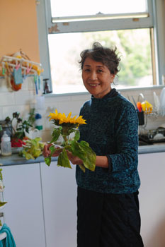  woman with a sunflower in her hand