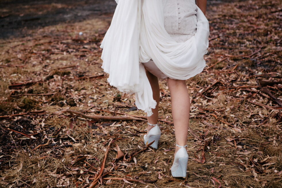 a bride running in the bush