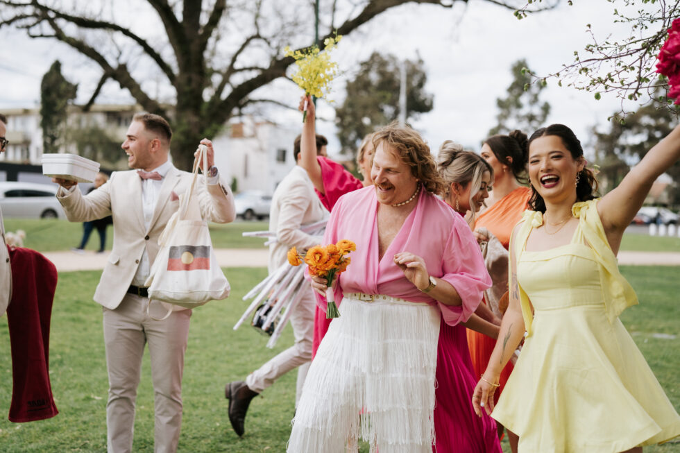 Bridal party having fun at the park
